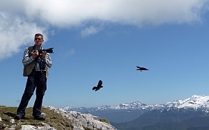 Jeff Clarke photographing Alpine Choughs at the <br />top of the cable car © Val Marshall
